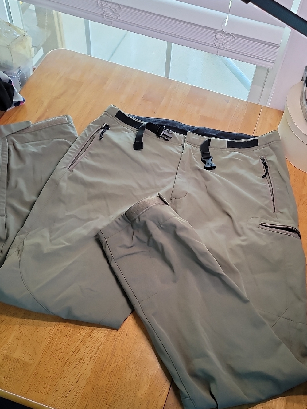 REI Co-op Technical Hiking Pants in a sage green/grey colorway